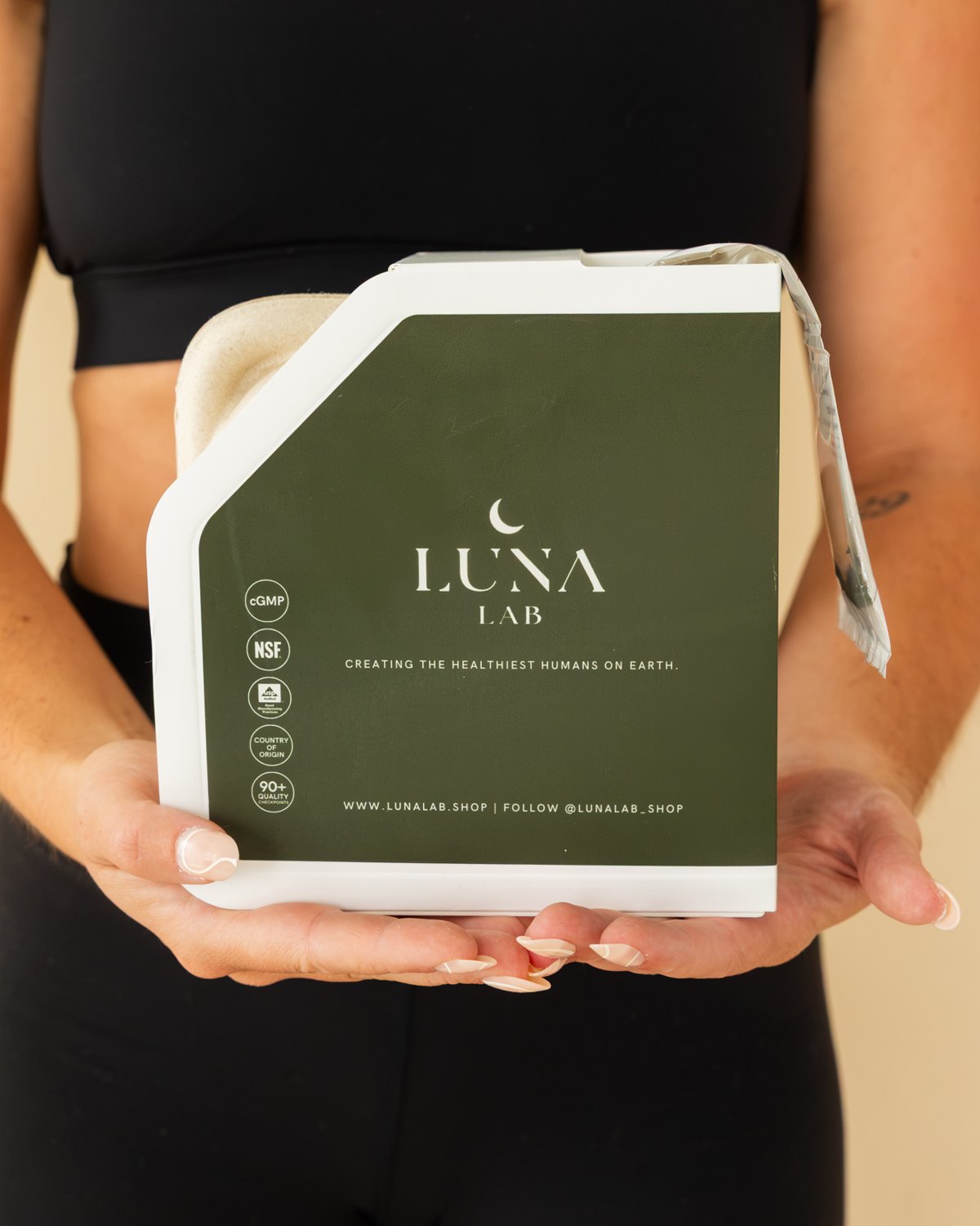 Woman holding the Herbal Cleanse Formula box